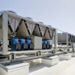 Rooftop cooling unit with chiller units and compressors.