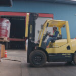 warehouse-pallets-of-red-drums
