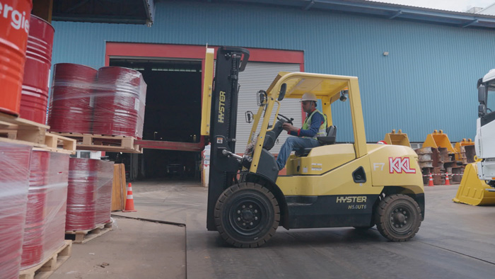 warehouse pallets of red drums