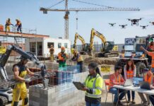 Workforce Transformation in Digital Construction Era The construction industry has historically struggled with a fragmented and opaque supply chain, often resulting in project delays, material waste, and disputes over quality. However, the emergence of smart construction supply chains enhance traceability is fundamentally altering this landscape. By leveraging the power of blockchain, the Internet of Things (IoT), and advanced data analytics, the industry is moving toward a highly transparent and efficient digital ecosystem. This transition allows for real-time visibility of materials from the point of manufacture to their final installation on-site, ensuring that every project is built with the right components, delivered at the right time, and verified for quality and compliance. This digital overhaul is no longer a luxury but a critical requirement for managing the complexity of modern mega-projects. Breaking Down Fragmentation through Digital Integration One of the primary challenges in construction logistics is the sheer number of stakeholders involved from raw material suppliers and manufacturers to freight forwarders and sub-contractors. Traditionally, each of these parties operated in their own data silo, leading to a lack of overall coordination. When smart construction supply chains enhance traceability, these silos are bridged by a centralized digital platform. This integration ensures that a change in the construction schedule on-site is instantly communicated back through the supply chain, allowing manufacturers to adjust their production cycles and logistics providers to re-route deliveries. This synchronized flow of information eliminates the "bullwhip effect" that often leads to costly bottlenecks and inventory build-up. It turns the supply chain from a series of reactive handovers into a proactive, data-driven partnership. The Role of Blockchain in Verifying Material Provenance At the heart of a transparent ecosystem lies the need for trust. Blockchain technology is a key driver of how smart construction supply chains enhance traceability by creating an immutable, decentralized ledger of every transaction. This is particularly vital for verifying the provenance and sustainability of materials. For instance, a contractor can use blockchain to verify that the steel they are using was produced with a specific recycled content or that the timber was sourced from a sustainably managed forest. This "digital certificate of authenticity" is tamper-proof, providing project owners and regulators with the high-level assurance they need that the building is compliant with all safety and environmental standards. It essentially creates a "digital thread" that connects the final building back to its origins in the natural world. IoT and Real-Time Tracking of Critical Components The "smart" aspect of these supply chains is powered by the Internet of Things (IoT). By attaching GPS and RFID tags to critical or high-value components, such as pre-cast concrete panels or complex HVAC units, project managers can track their location in real-time. This level of visibility means that smart construction supply chains enhance traceability by allowing for "Just-In-Time" (JIT) delivery. Instead of materials sitting on-site for weeks and risking damage or theft, they arrive exactly when they are needed for installation. Furthermore, IoT sensors can monitor the condition of materials during transport, flagging if a sensitive component has been exposed to excessive vibration, humidity, or temperature fluctuations that might compromise its structural integrity. This real-time feedback loop allows for immediate intervention and prevents the installation of faulty parts. Digital Procurement and Automated Workflow Efficiency The administrative burden of construction procurement managing thousands of invoices, purchase orders, and delivery notes is a significant source of inefficiency. Smart construction supply chains enhance traceability by automating these workflows through digital procurement platforms. Smart contracts, built on top of a blockchain, can automatically trigger payments once a delivery has been verified by an on-site sensor or a digital sign-off. This reduces the time spent on manual reconciliation and speeds up the cash flow for suppliers, fostering a more collaborative and stable project environment. Automation ensures that the procurement team can focus on strategic sourcing and relationship management rather than chasing paperwork and resolving payment disputes. It also creates an audit-ready financial record that simplifies project close-outs. Enhancing Quality Control and Reducing Rework Rework is one of the biggest drains on construction profitability, often caused by the use of incorrect or substandard materials. When smart construction supply chains enhance traceability, every material has a "digital twin" that contains its full quality record. On-site teams can use mobile devices to scan a component's QR code and instantly access its test results, installation instructions, and warranty information. This ensures that only verified materials are used and that they are installed according to the manufacturer's specifications. If a quality issue is discovered later, the traceability system allows for a surgical "recall," identifying exactly where other components from the same batch were installed across the project. This targeted approach saves thousands of hours in manual inspections and protects the long-term reputation of the contractor. Sustainability and the Circular Economy Link Traceability is the essential foundation for a circular economy in the built environment. To reuse materials from a demolished building in the future, we must know exactly what they are and how they were maintained. Smart construction supply chains enhance traceability by creating a "Material Passport" for every component. This record follows the material throughout its life, documenting its maintenance history and any repairs. When a building eventually reaches its end-of-life, this data allows future "urban miners" to safely and profitably recover and reuse the materials, closing the loop and drastically reducing the industry's reliance on virgin resources. This long-term vision turns the supply chain from a linear "path to the site" into a continuous cycle of material management that spans decades. Mitigating Risks in Global Supply Chain Logistics The global nature of construction materials sourcing marble from Italy, electronics from Asia, and timber from Scandinavia introduces significant risks, from geopolitical instability to shipping delays. Smart construction supply chains enhance traceability by providing "predictive logistics." By integrating weather data, port congestion reports, and global news feeds, the system can predict disruptions before they happen and suggest alternative routes or suppliers. This proactive risk management is what allows complex mega-projects to stay on track even in a volatile global environment. The ability to "see around the corner" is a major competitive advantage, allowing firms to pivot their procurement strategies in response to real-time global events. It transforms risk from a threat into a manageable variable in the project equation. Strengthening Compliance and Regulatory Reporting Regulatory requirements for safety and environmental disclosure are becoming increasingly strict. Governments now often require "chain of custody" documentation for critical materials like structural steel and fire-safety equipment. Smart construction supply chains enhance traceability by automatically generating these reports as the project progresses. Instead of a frantic scramble for documentation at the end of a project, the developer has a complete, verified digital record of every material used. This transparency not only ensures compliance but also reduces the cost of audits and insurance, as the firm can prove its adherence to the highest standards of quality and ethical sourcing. It builds a foundation of trust with public authorities and the local community that is essential for long-term business success. The Role of Data Analytics in Continuous Improvement The data generated by a traceable supply chain is a goldmine for continuous improvement. By analyzing historical delivery data, a firm can identify which suppliers are the most reliable and which routes are the most efficient. Smart construction supply chains enhance traceability by providing the benchmarks needed to optimize future projects. Machine learning algorithms can predict the likely delivery time for a specific type of component under various conditions, allowing for more realistic project scheduling. This "loop of learning" ensures that every project becomes smarter and more efficient than the last, driving long-term industry productivity. It moves the industry away from "one-off" project thinking toward a more sophisticated, manufacturing-style approach to delivery. Future Outlook: The Fully Autonomous Supply Chain As technology continues to evolve, we are moving toward a future of fully autonomous construction logistics. In this vision, the BIM model itself acts as the purchasing agent. When the digital schedule indicates that plumbing work will begin in three weeks, the system automatically checks inventory, solicits bids from a pre-approved network of suppliers, and places the order based on a combination of price, speed, and carbon footprint. Self-driving trucks and drones then deliver the materials to the site, where robotic systems handle the unloading and sorting. This level of autonomy, underpinned by the fact that smart construction supply chains enhance traceability, will represent the ultimate realization of efficiency and transparency in the built environment. It will allow humans to focus on the "why" of building, while the machines handle the "how." Conclusion: Visibility as the Foundation of Excellence The construction industry is shedding its reputation for being "low-tech" and opaque. The adoption of smart construction supply chains enhance traceability is at the center of this transformation. By creating a visible, accountable, and interconnected digital ecosystem, we are not just improving logistics; we are improving the quality, safety, and sustainability of the buildings themselves. Visibility is the foundation upon which excellence is built. As these technologies become the industry standard, the friction and uncertainty of the past will give way to a future of seamless, data-driven execution, ensuring that our infrastructure is built to the highest possible standards of transparency and trust. The future of building is bright, and it is powered by data that never sleeps.