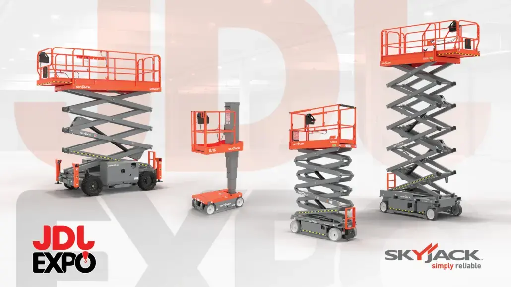 Group of red Skyjack scissor lifts of varying heights on a showroom floor with JDL Expo branding in the corner.